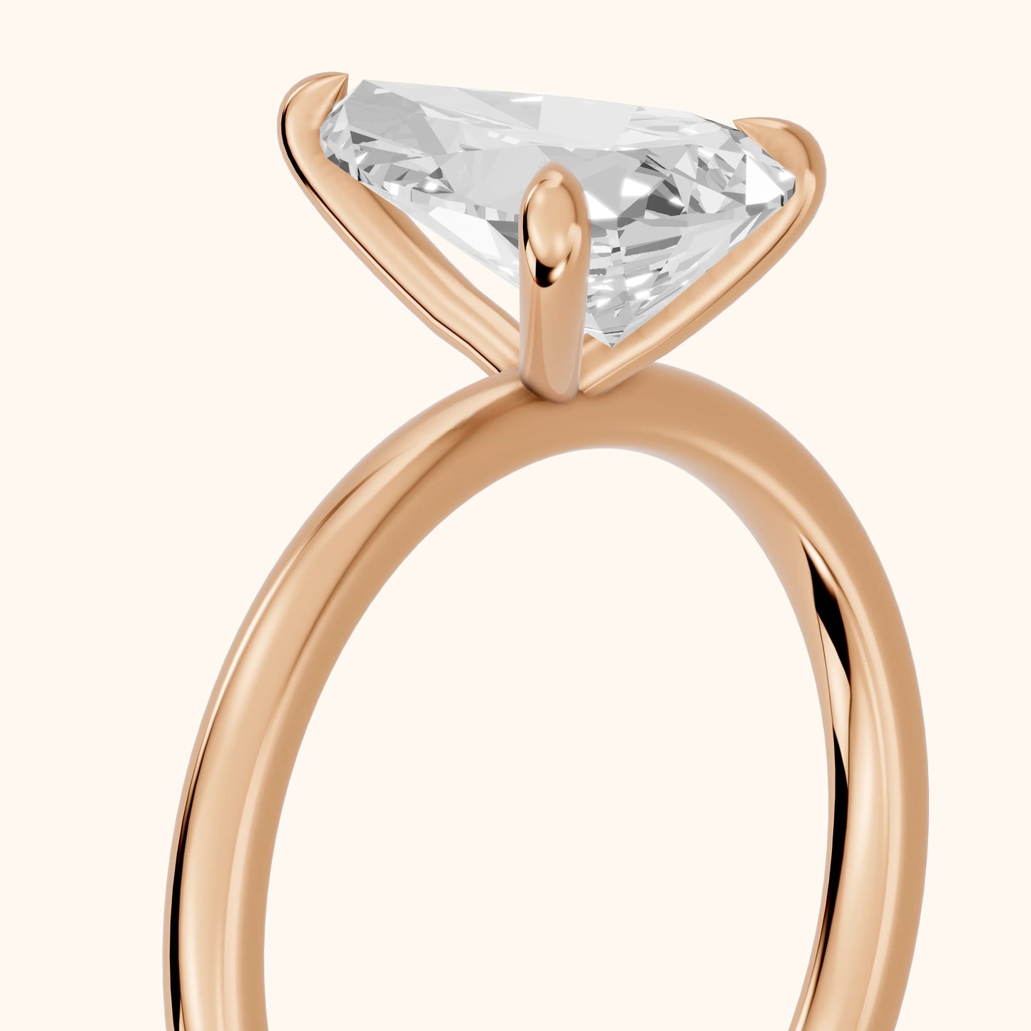 Nella Petite Solitaire Pear Diamond Engagement Ring in Rose Gold - slant-view.webp