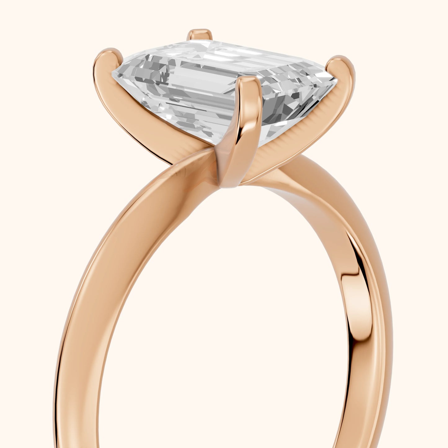 Wren Solitaire Emerald Diamond Ring in Rose Gold - slant-view.webp