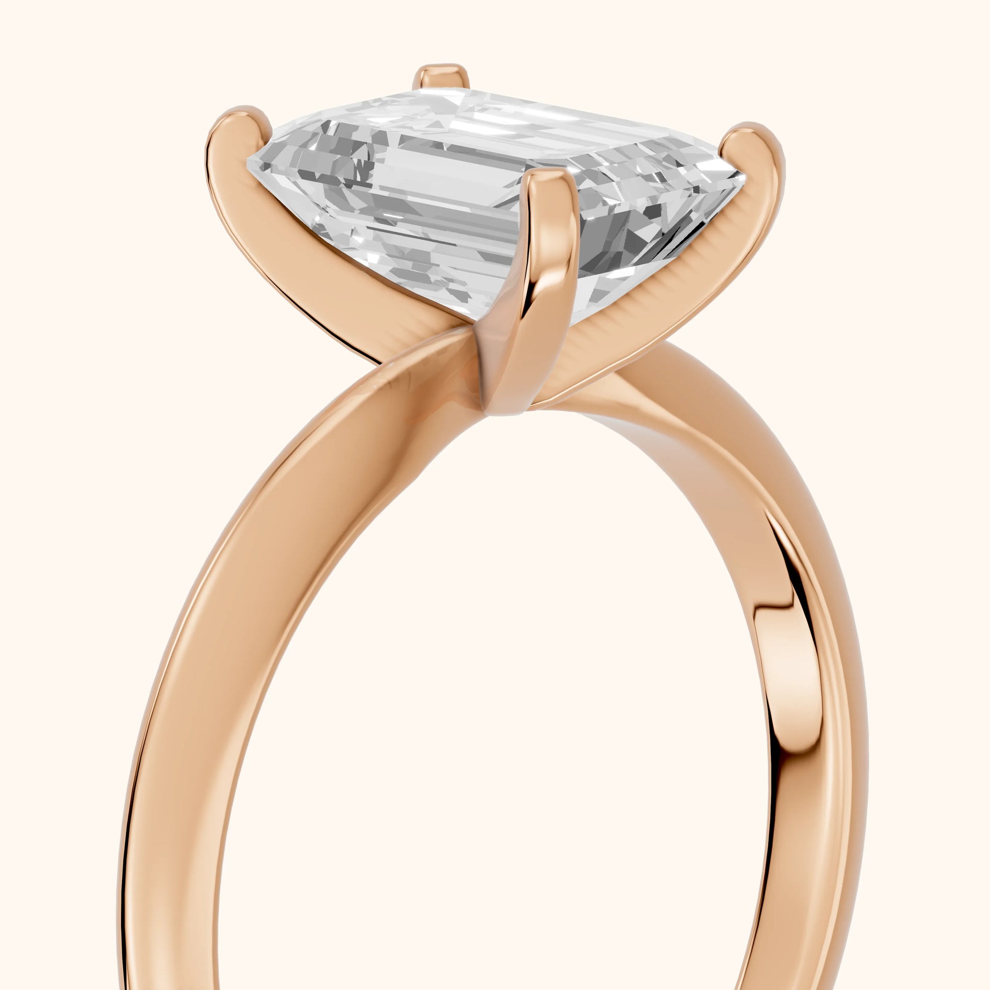 Wren Solitaire Emerald Diamond Ring in Rose Gold - slant-view.webp