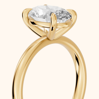 Cassandra Claw Prong Solitaire Oval Diamond Engagement Ring in Yellow Gold - slant-view.webp