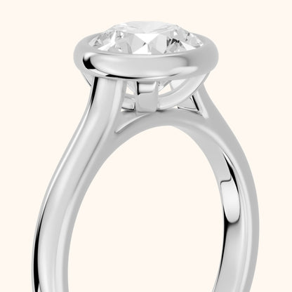 Jolie Bezel Solitaire Round Diamond Engagement Ring in Platinum - slant-view.webp