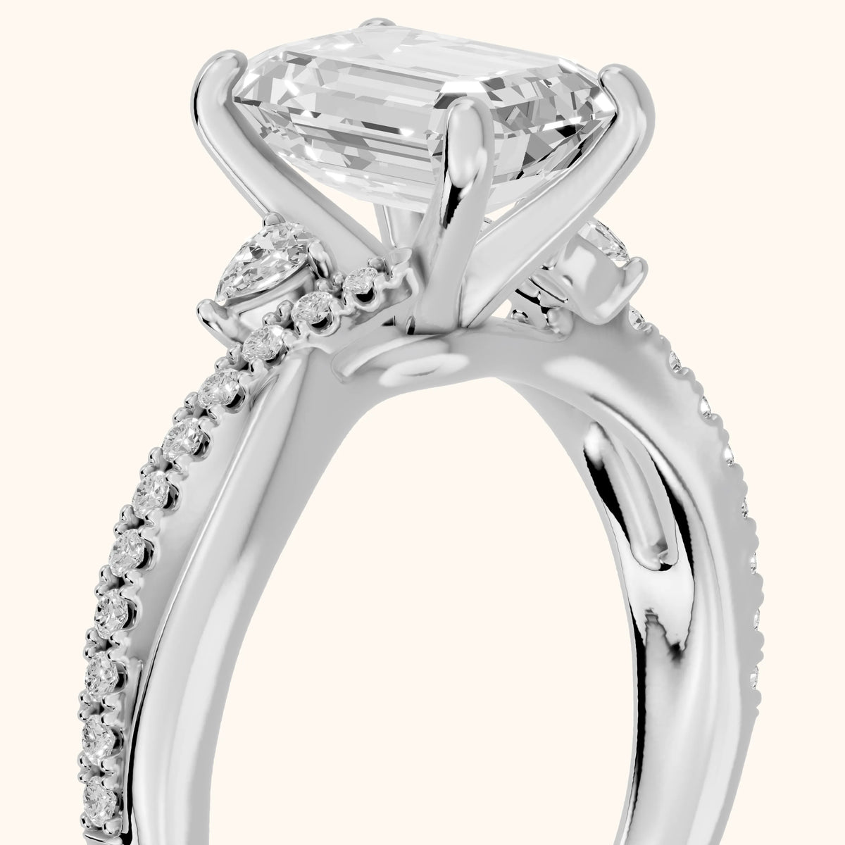 Reno Pear-Side Twist Emerald Diamond Engagement Ring in Platinum - slant-view.webp