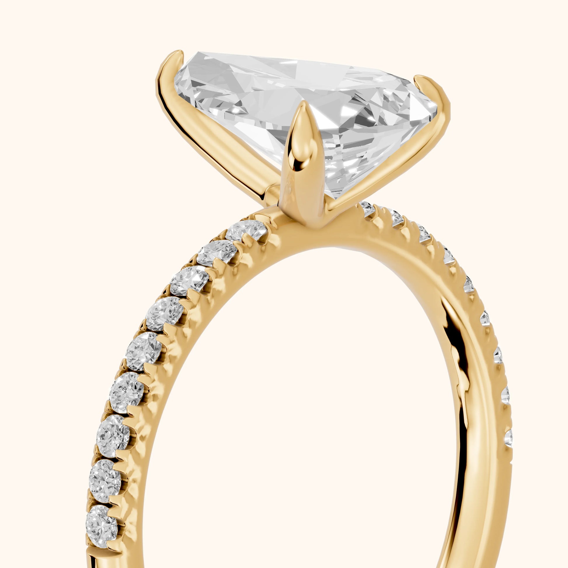 Ione Solitaire Pavé Pear Diamond Engagement Ring in Yellow Gold - slant-view.webp