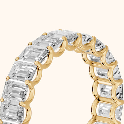 Josette Shared Prong Emerald Diamond Eternity Band in Yellow Gold - slant-view