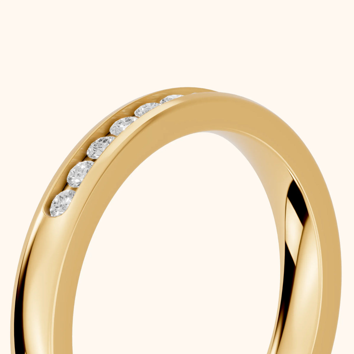 Coralie Channel Set Round Diamond Wedding Band in Yellow Gold - slant-view