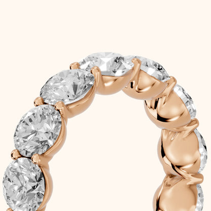 Aditi Claw Prong Round Diamond Eternity Band in Rose Gold - slant-view