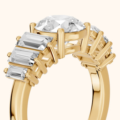 Mara Sidestone Baguette Accent Round Diamond Engagement Ring in Yellow Gold - slant-view.webp