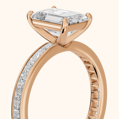 Brielle Channel Set Solitaire Emerald Diamond Ring in Rose Gold - slant-view.webp