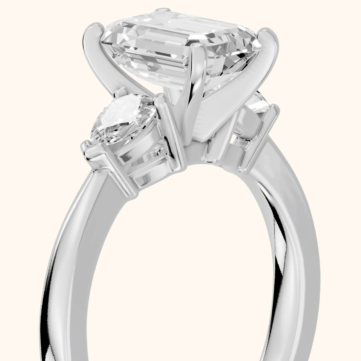 Amabel Three-Stone Emerald Diamond Engagement Ring in Platinum - slant-view.webp