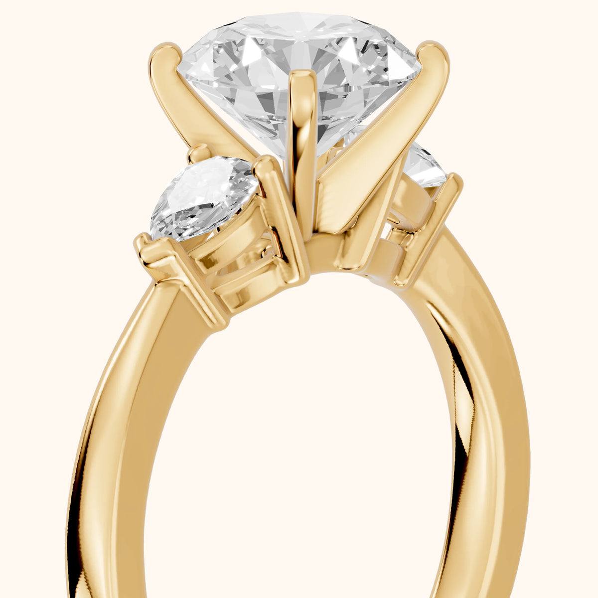 Amabel Three-Stone Round Diamond Engagement Ring in Yellow Gold - slant-view.webp