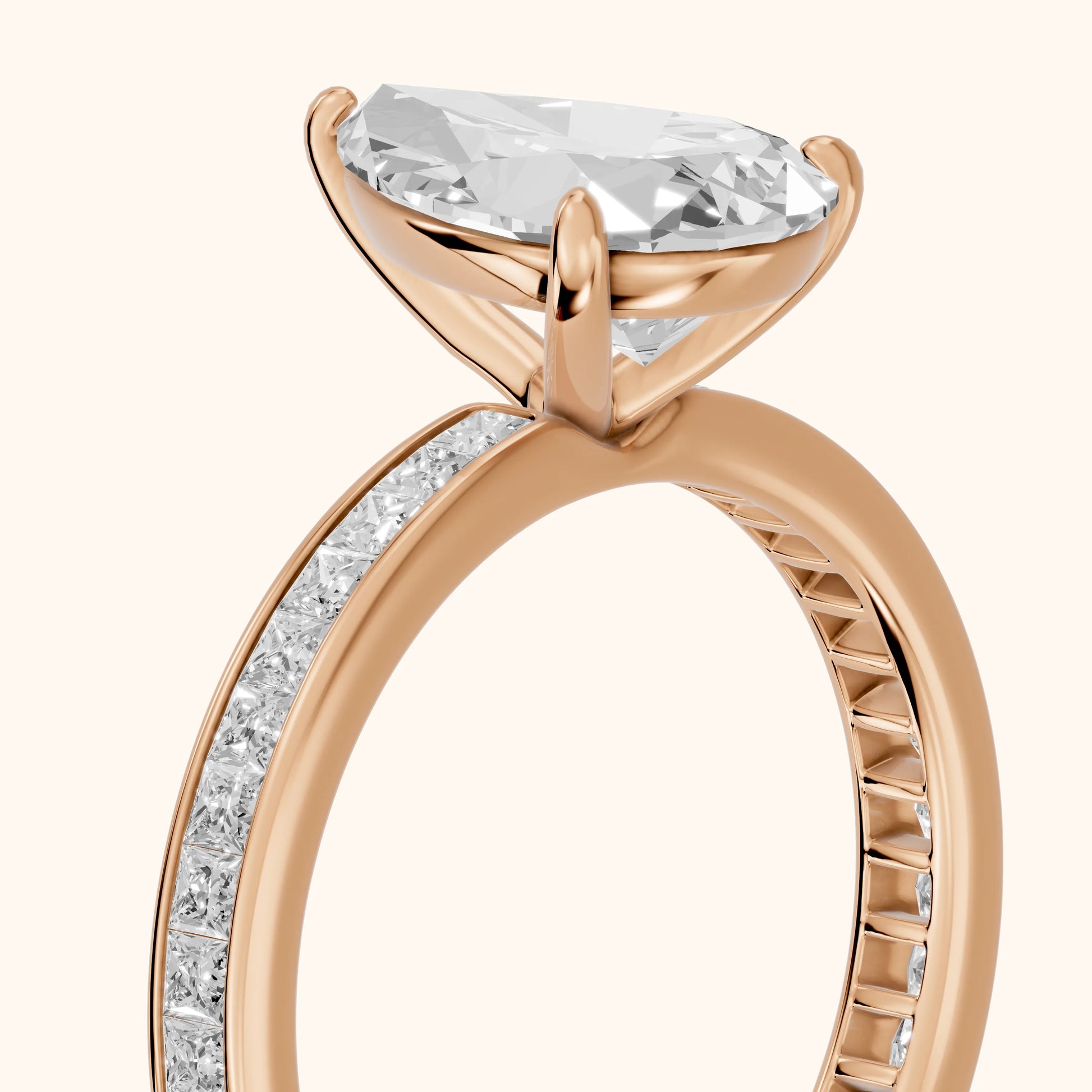 Brielle Channel Set Solitaire Pear Diamond Ring in Rose Gold - slant-view.webp