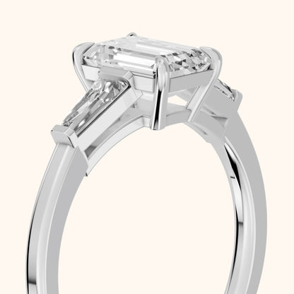 Winnie Three-Stone Emerald Diamond Engagement Ring in Platinum - slant-view.webp