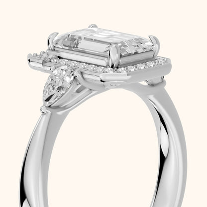Eliza Halo Sidestone Emerald Diamond Engagement Ring in Platinum - slant-view.webp