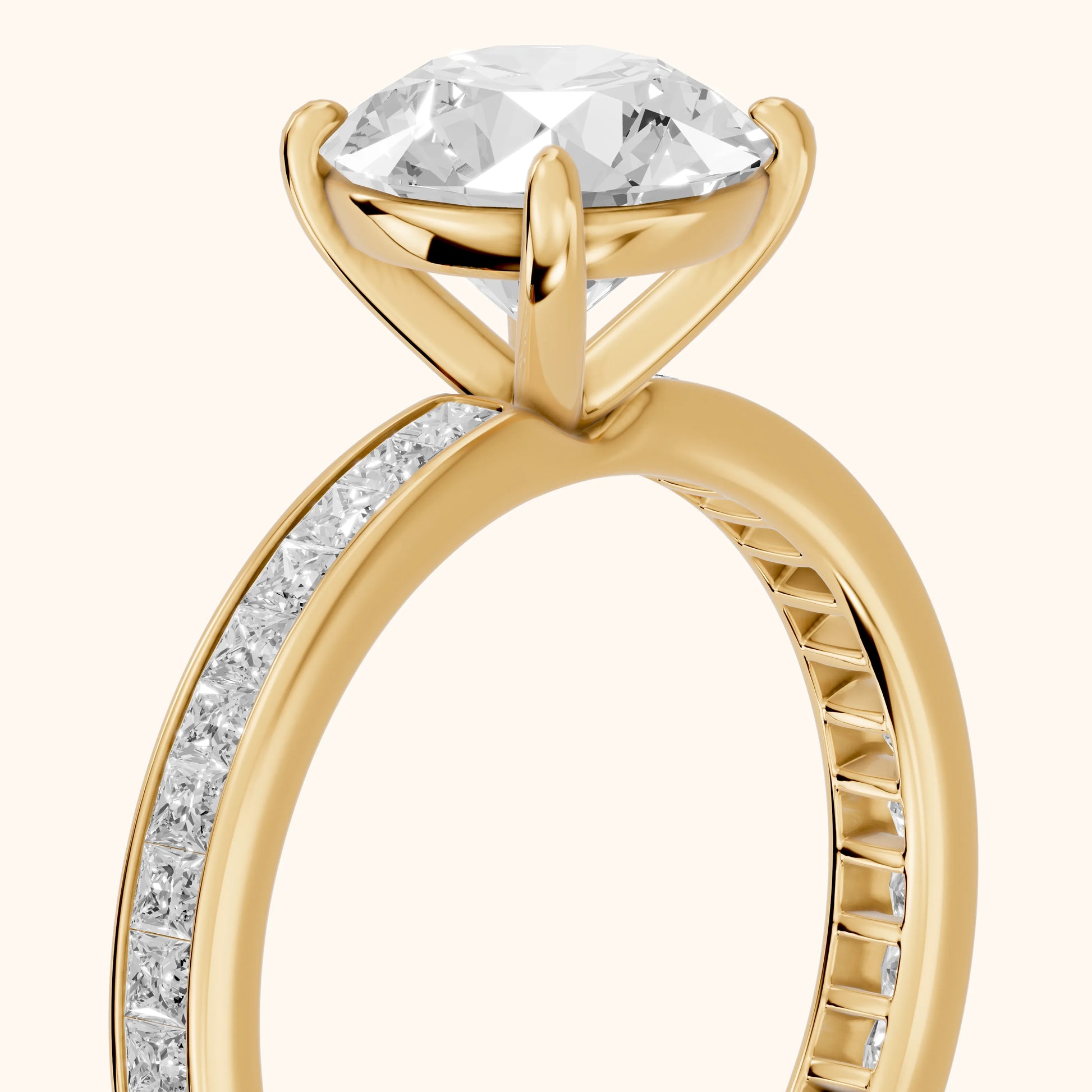Brielle Channel Set Solitaire Round Diamond Ring in Yellow Gold - slant-view.webp