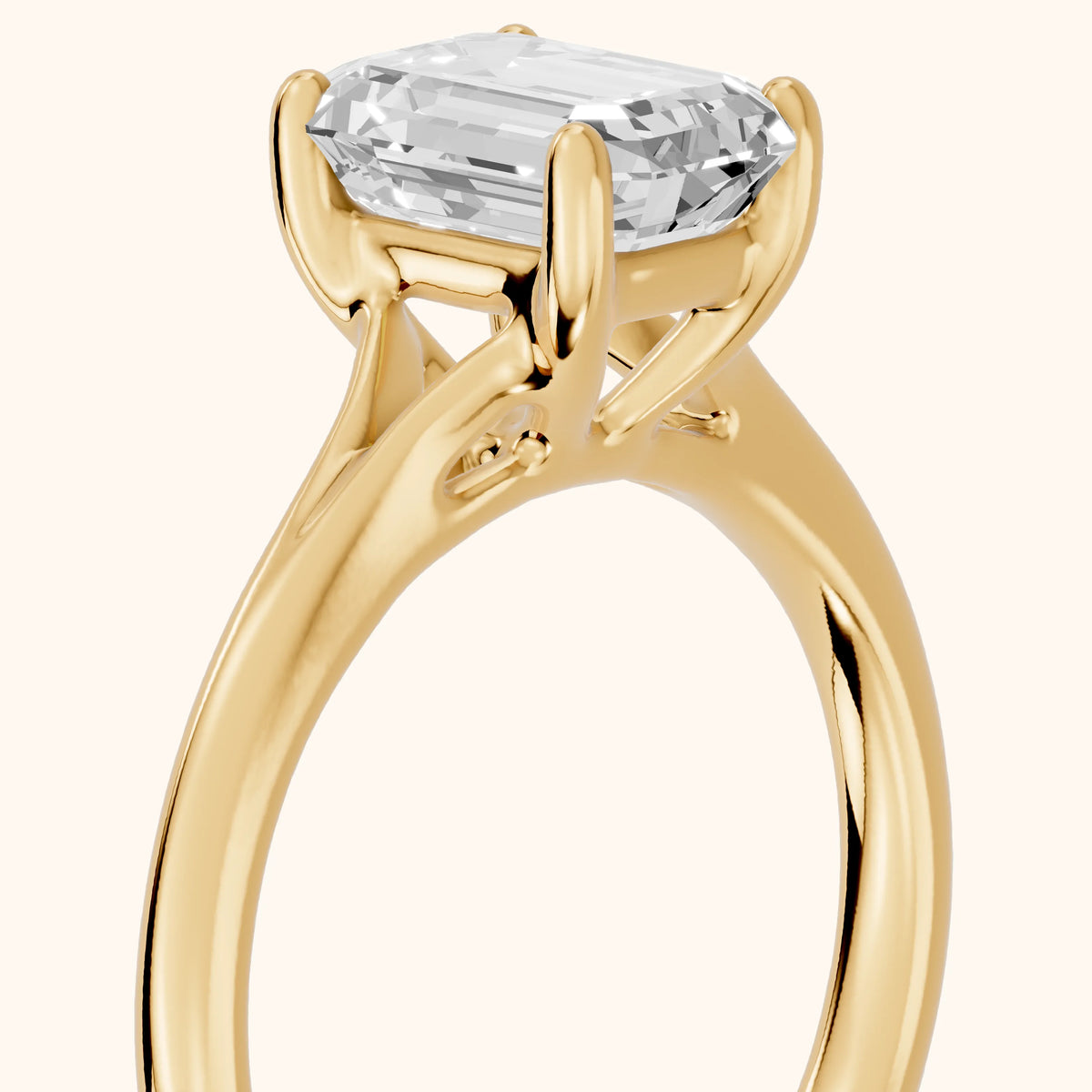 Melanie Solitaire Split Shank Emerald Diamond Engagement Ring in Yellow Gold - slant-view.webp