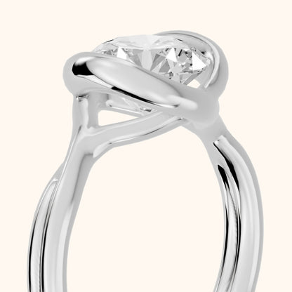 Lucille Half Bezel Solitaire Round Diamond Engagement Ring in Platinum - slant-view.webp