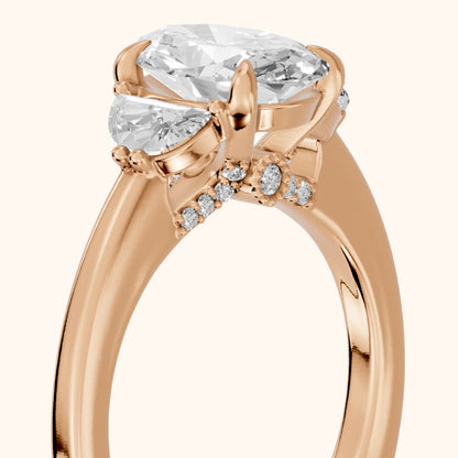 Madera Half-Moon Three-Stone Oval Diamond Engagement Ring in Rose Gold - slant-view.webp