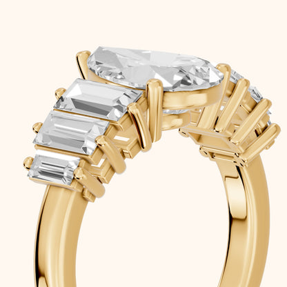 Mara Sidestone Baguette Accent Pear Diamond Engagement Ring in Yellow Gold - slant-view.webp