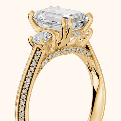 Aspen Three-Stone Knife Edge Emerald Diamond Engagement Ring in Yellow Gold - slant-view.webp