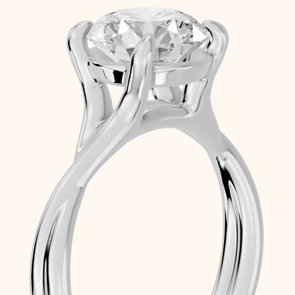 Rosa Twist Solitaire Round Diamond Engagement Ring in Platinum - slant-view.webp