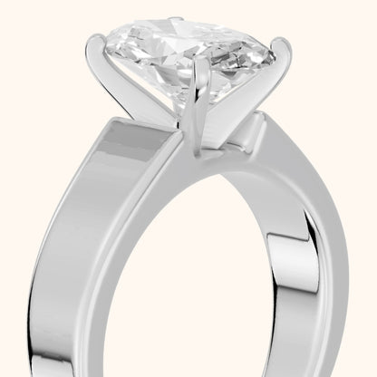 Susannah Wide Band Solitaire Oval Diamond Engagement Ring in Platinum - slant-view.webp