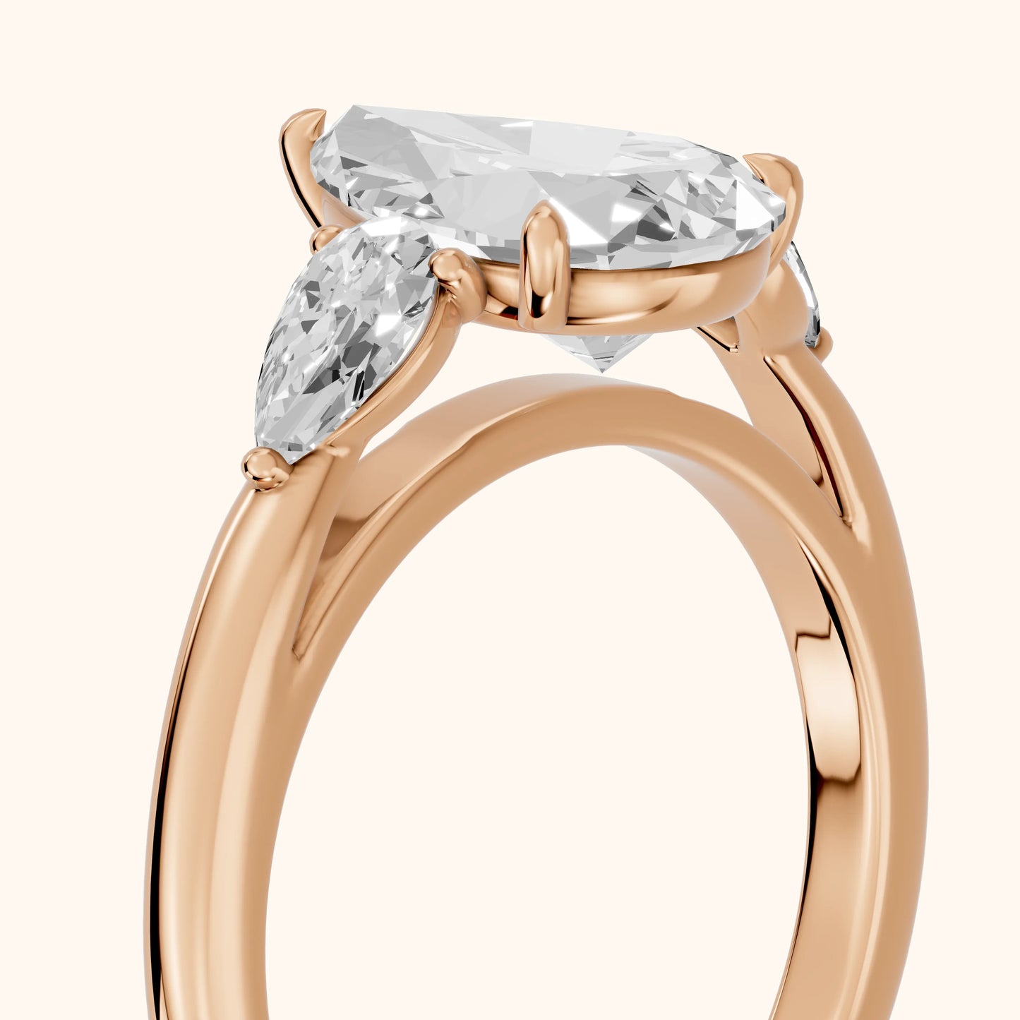 Phoebe Three-Stone Pear Diamond Ring in Rose Gold - slant-view.webp