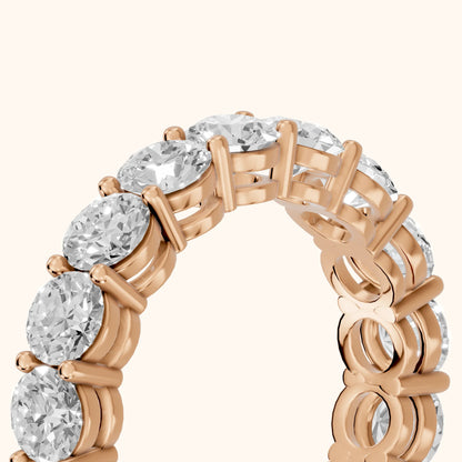 Camille Shared Prong Round Diamond Eternity Band in Rose Gold - slant-view