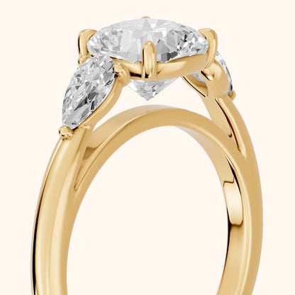 Phoebe Three-Stone Cushion Diamond Ring in Yellow Gold - slant-view.webp