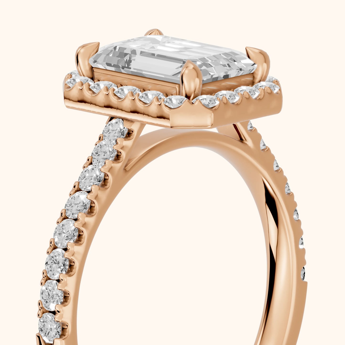 Amara Halo Claw Prong Emerald Diamond Ring in Rose Gold - slant-view.webp