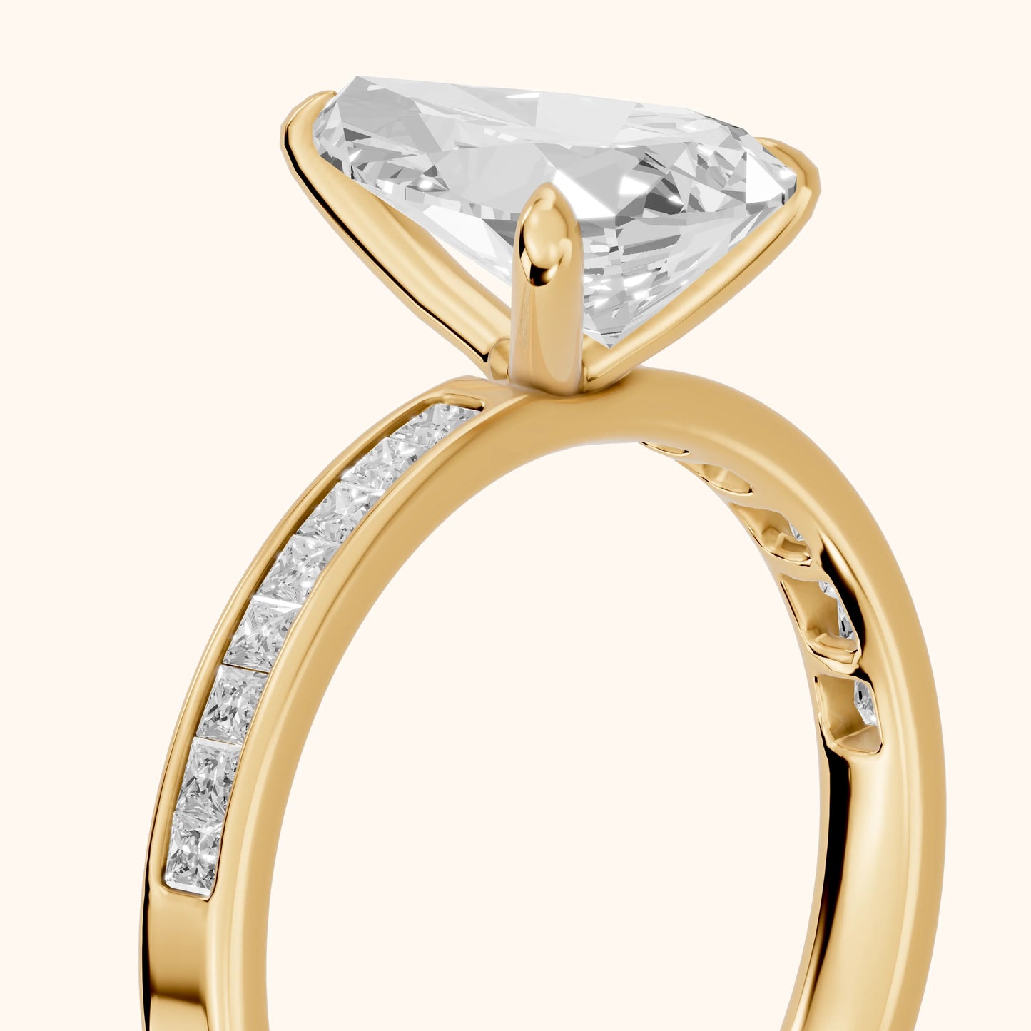 Maren Sidestone Channel Set Pear Diamond Engagement Ring in Yellow Gold - slant-view.webp