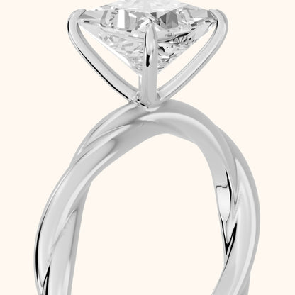 Nicola Twist Solitaire Princess Diamond Engagement Ring in White Gold - slant-view.webp