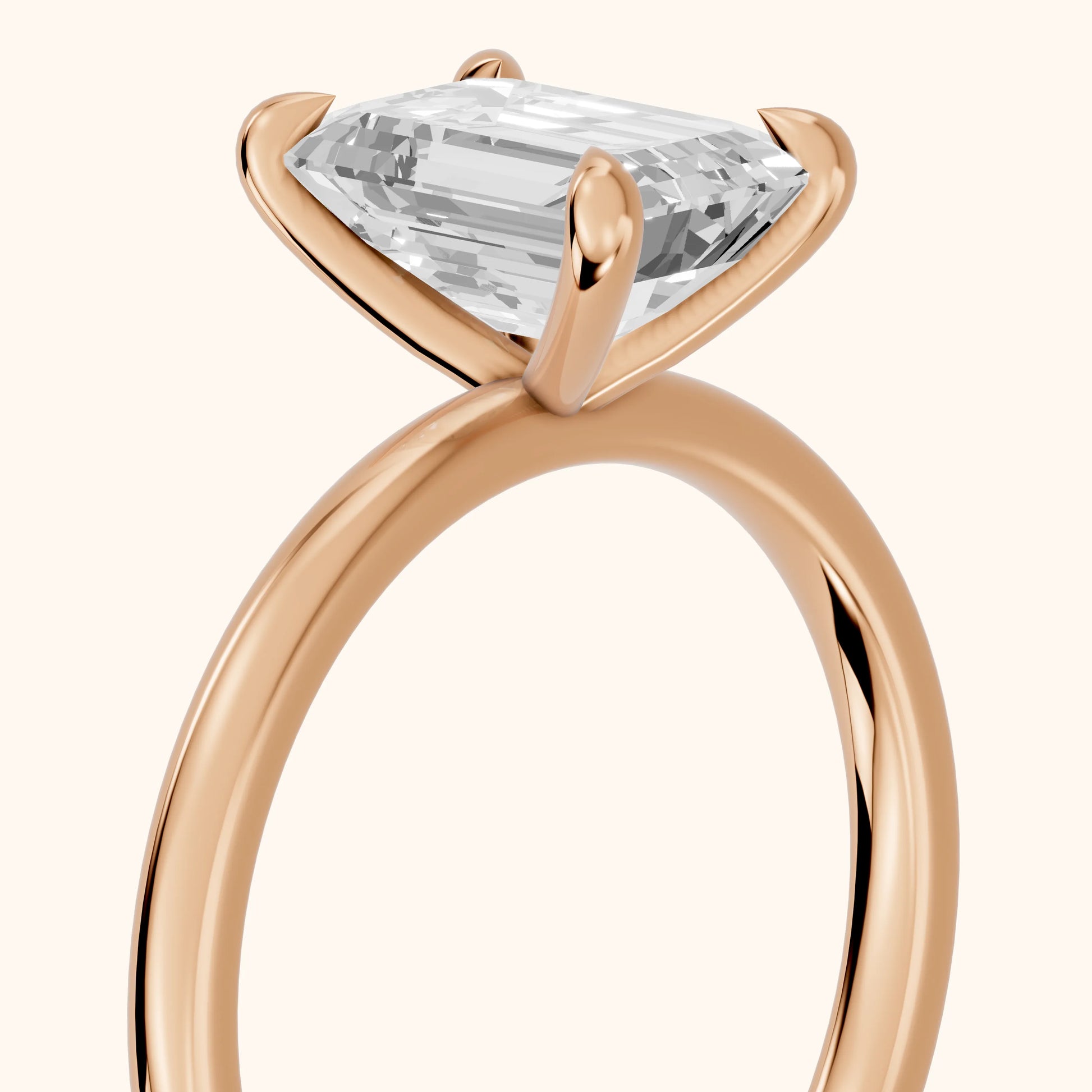 Nella Petite Solitaire Emerald Diamond Engagement Ring in Rose Gold - slant-view.webp