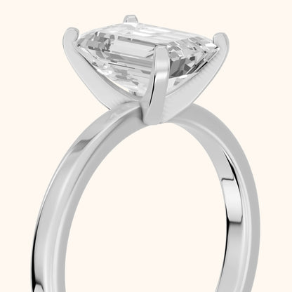 Liana Solitaire Claw Prong Emerald Diamond Engagement Ring in Platinum - slant-view.webp