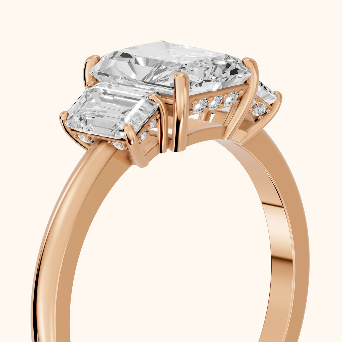 Marian Three-Stone Hidden Halo Radiant Diamond Engagement Ring in Rose Gold - slant-view.webp
