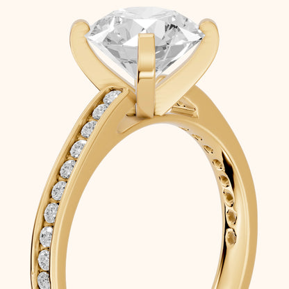 Tessa Solitaire Channel Set Round Diamond Engagement Ring in Yellow Gold - slant-view.webp