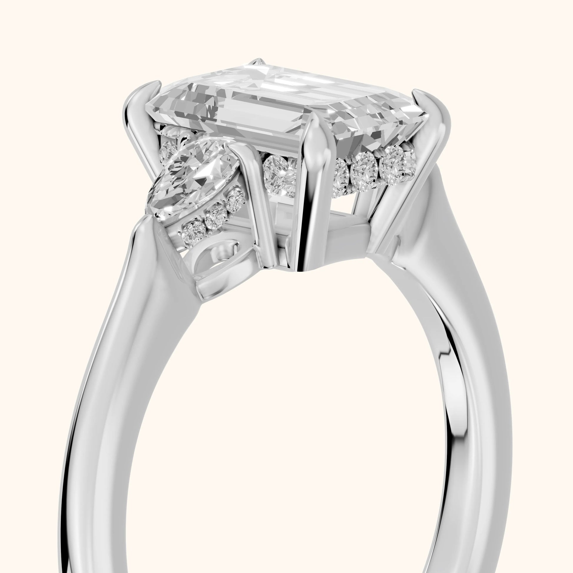 Leila Three-Stone Emerald Diamond Engagement Ring in Platinum - slant-view.webp