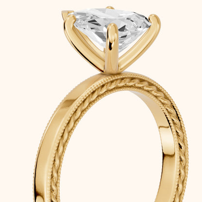 Kerry Engraved Solitaire Pear Diamond Engagement Ring in Yellow Gold - slant-view.webp