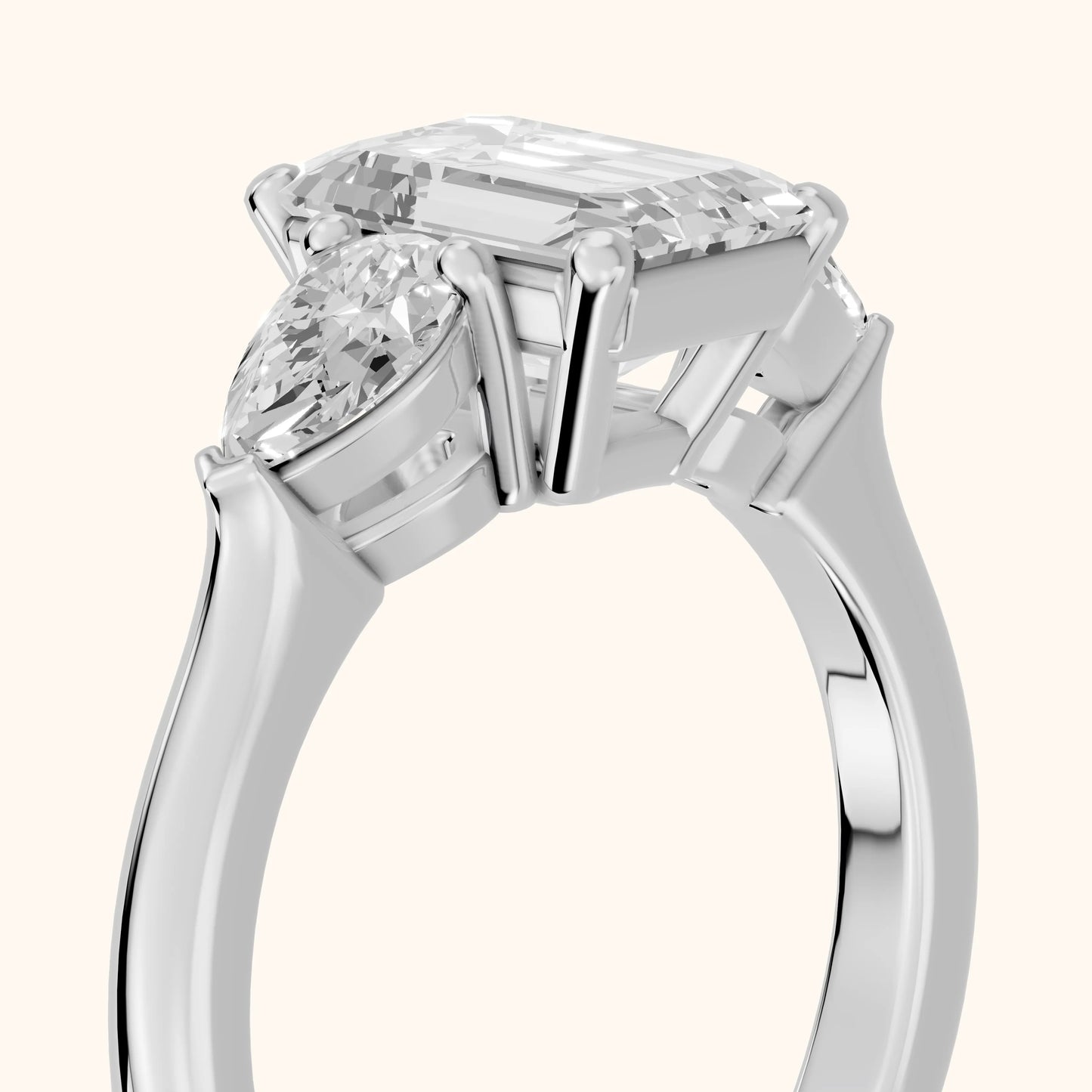 Mirabel Three-Stone Emerald Diamond Engagement Ring in Platinum - slant-view.webp