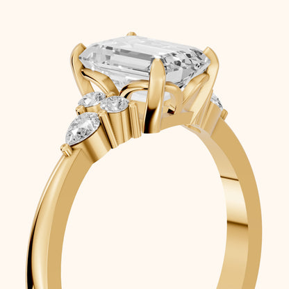 Amelia Three Stone Emerald Diamond Engagement Ring in Yellow Gold - slant-view.webp