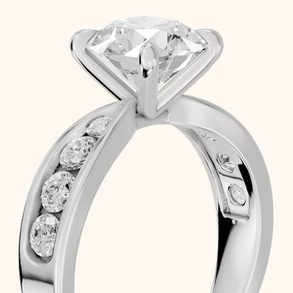 Noor Channel Set Sidestone Round Diamond Engagement Ring in White Gold - slant-view.webp