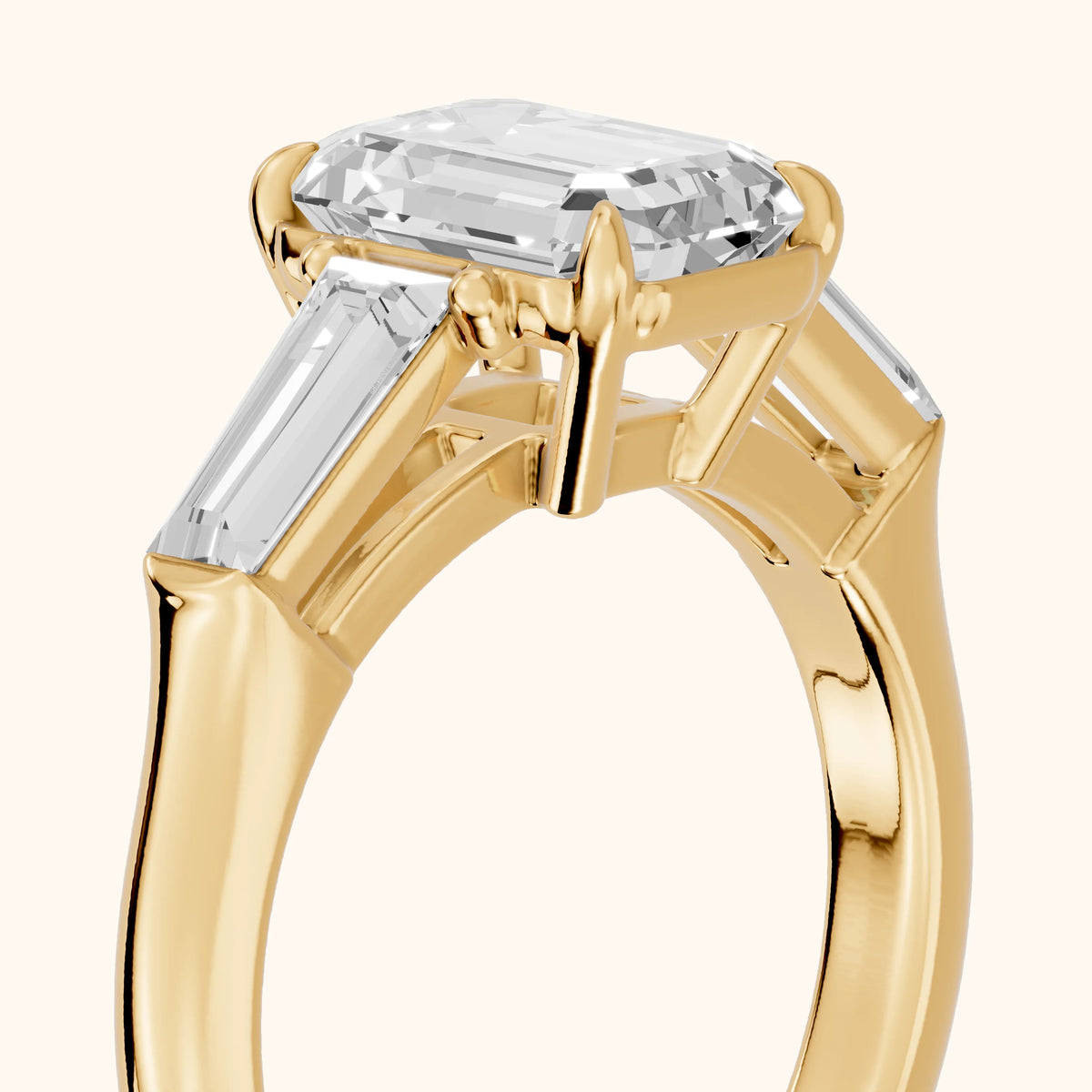 Davina Baguette Three-Stone Emerald Diamond Engagement Ring in Yellow Gold - slant-view.webp