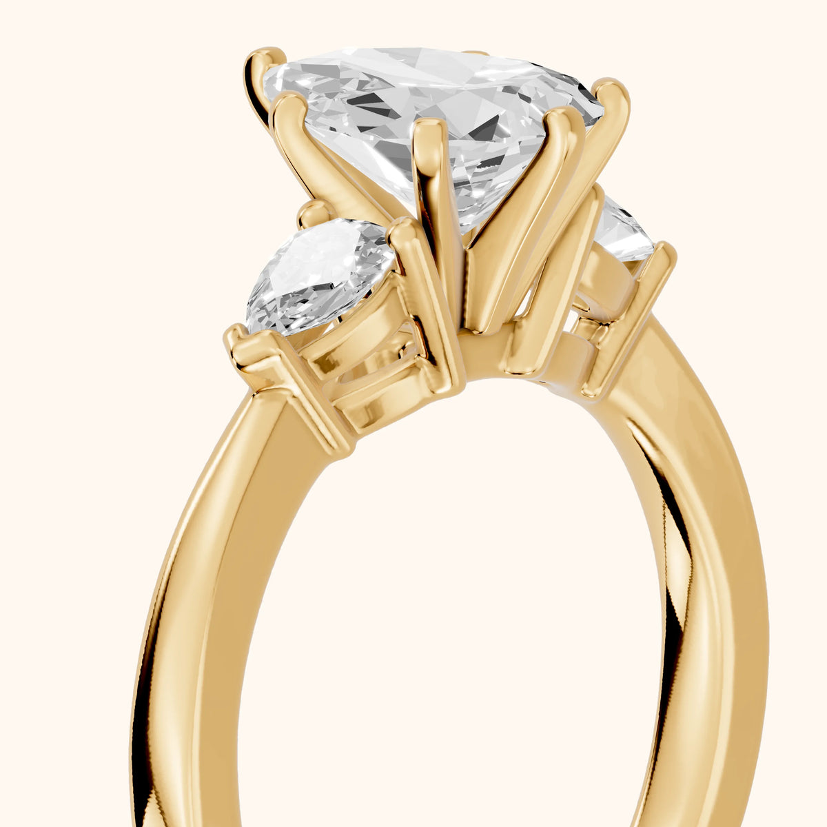 Amabel Three-Stone Pear Diamond Engagement Ring in Yellow Gold - slant-view.webp