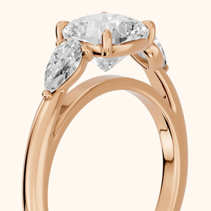 Phoebe Three-Stone Cushion Diamond Ring in Rose Gold - slant-view.webp