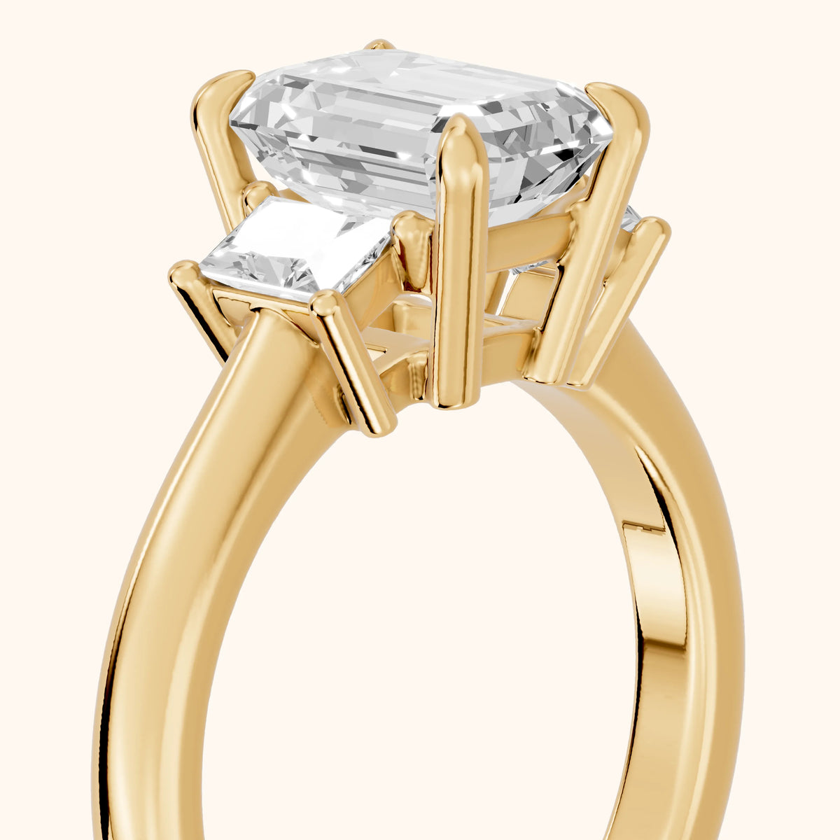 Cosette Statement Three-Stone Emerald Diamond Engagement Ring in Yellow Gold - slant-view.webp