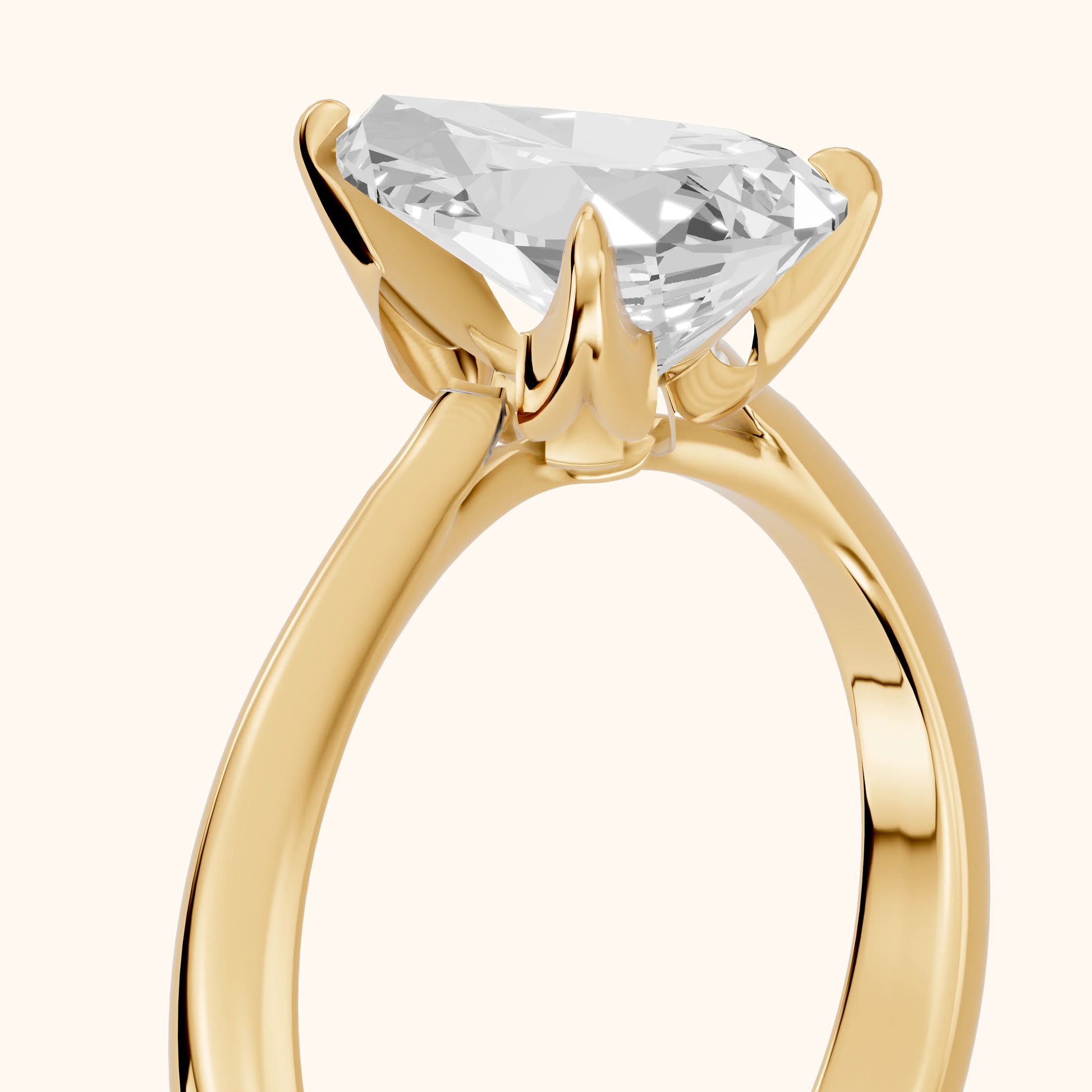 Evie Solitaire Six-Prong Pear Diamond Engagement Ring in Yellow Gold - slant-view.webp