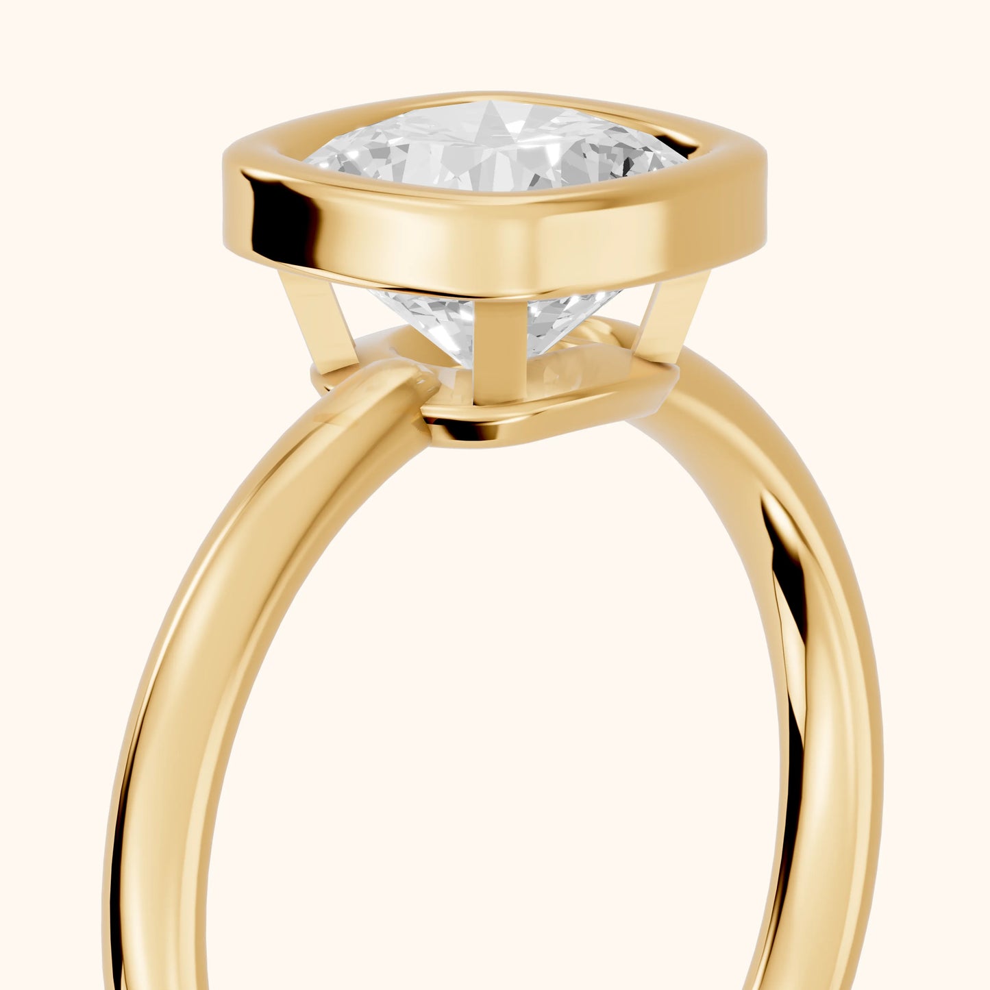 Maeve Bezel Solitaire Cushion Diamond Ring in Yellow Gold - slant-view.webp