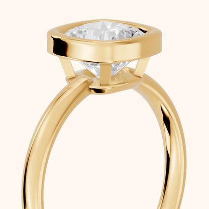 Maeve Bezel Solitaire Cushion Diamond Ring in Yellow Gold - slant-view.webp