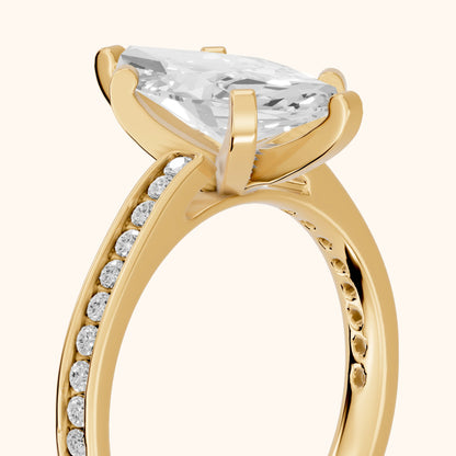 Tessa Solitaire Channel Set Marquise Diamond Engagement Ring in Yellow Gold - slant-view.webp