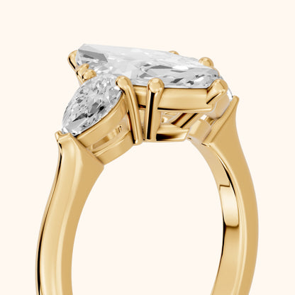 Mirabel Three-Stone Marquise Diamond Engagement Ring in Yellow Gold - slant-view.webp
