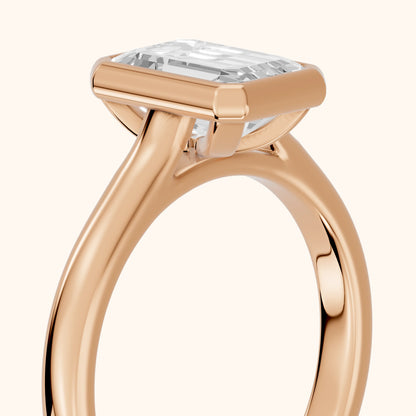 Jolie Bezel Solitaire Emerald Diamond Engagement Ring in Rose Gold - slant-view.webp
